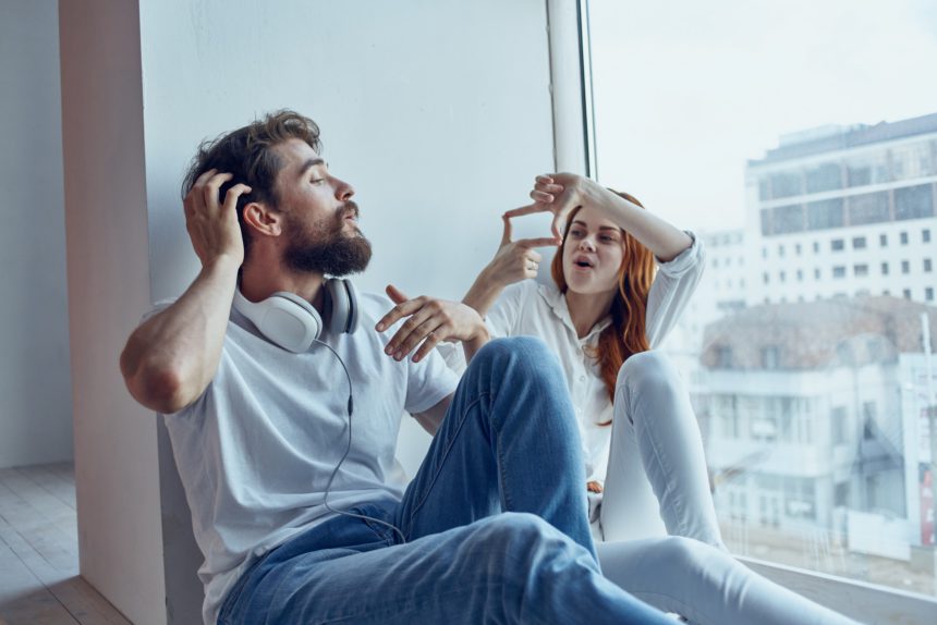 Man and woman sitting on the windowsill love Lifestyle